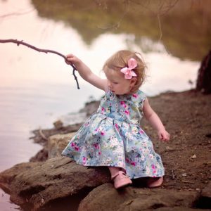 Light Pink clip on little girl in blue dress